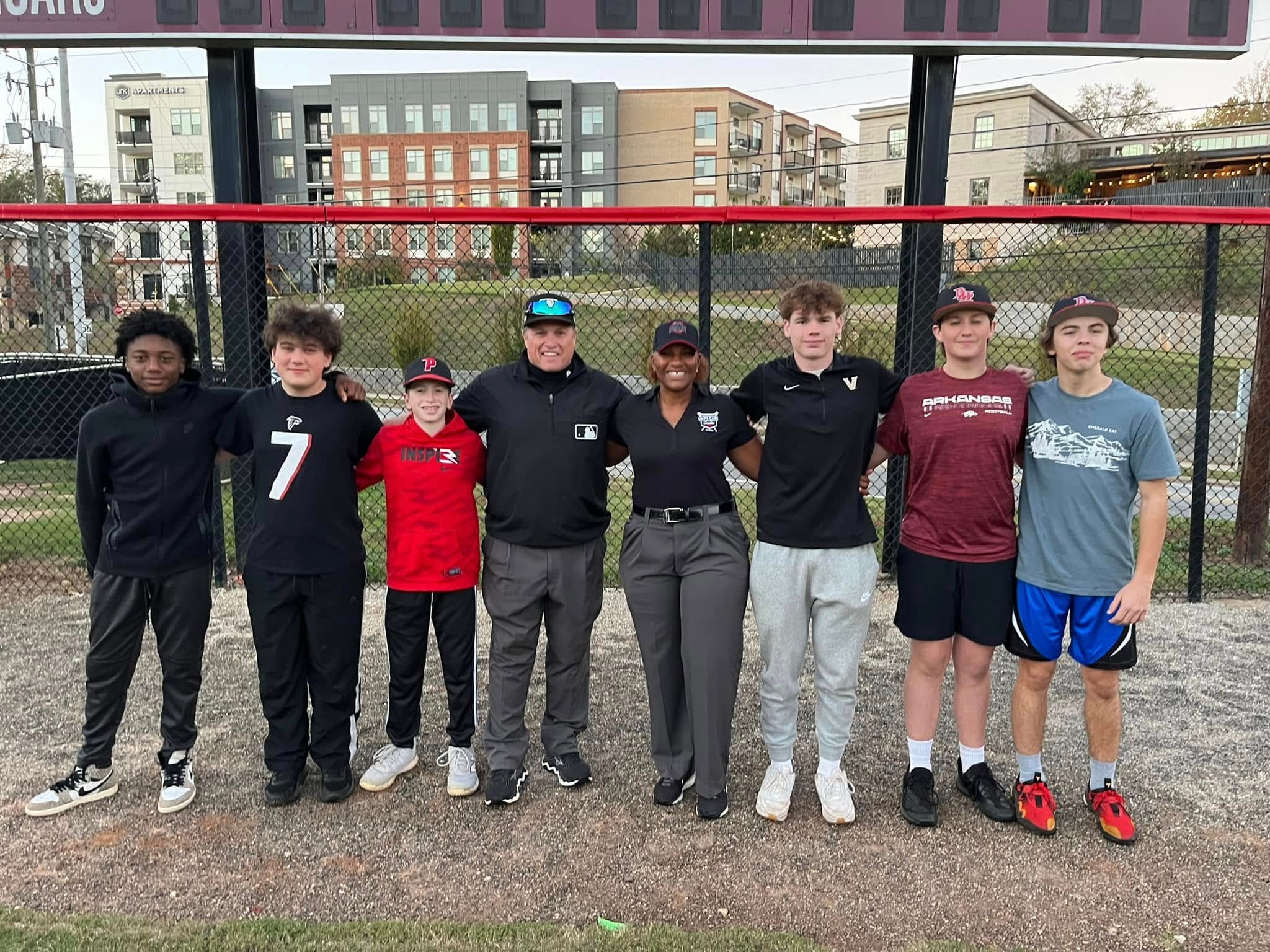 Umpires and youth at baseball field