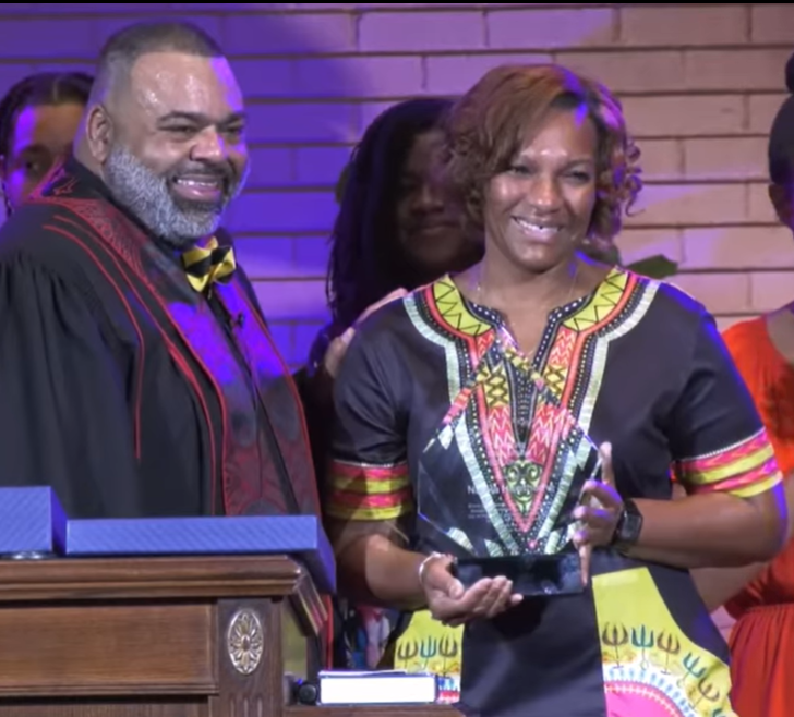 Natola D. Hawthorne receiving the scholarship award